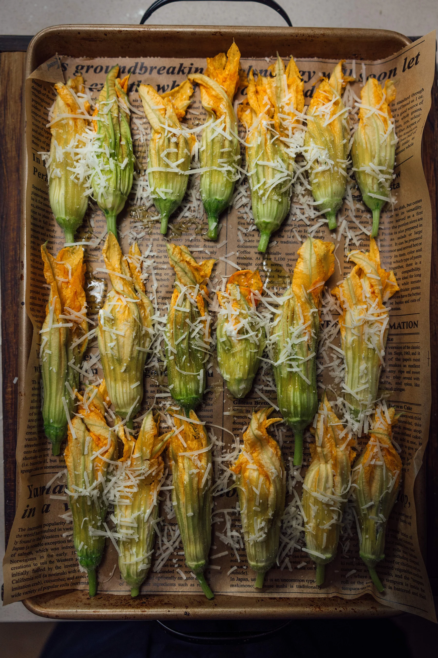 Zucchini blossoms on a baking tray