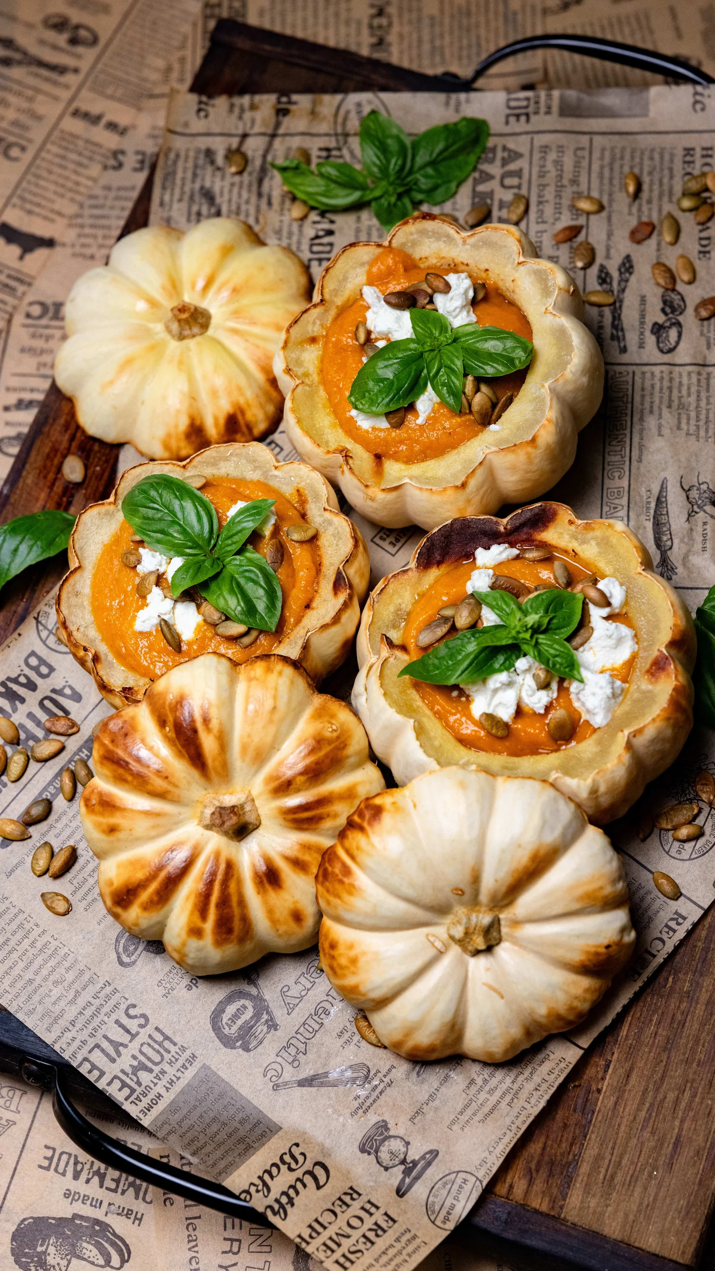 Pumpkin soup served in small white pumpkins