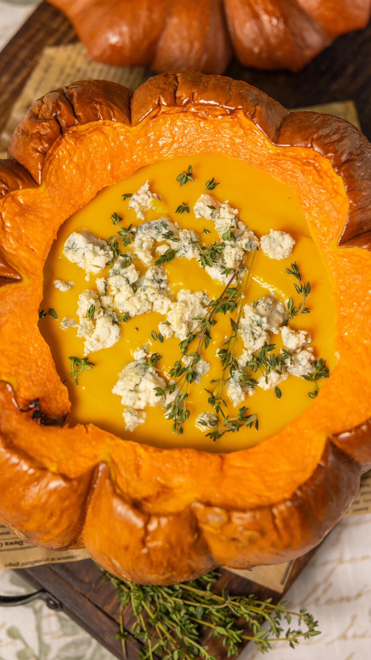 Pumpkin soup served inside a roasted pumpkin